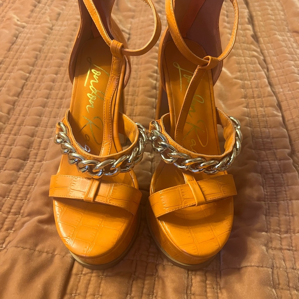 Elegant Orange Heels with Gold Chain Accent